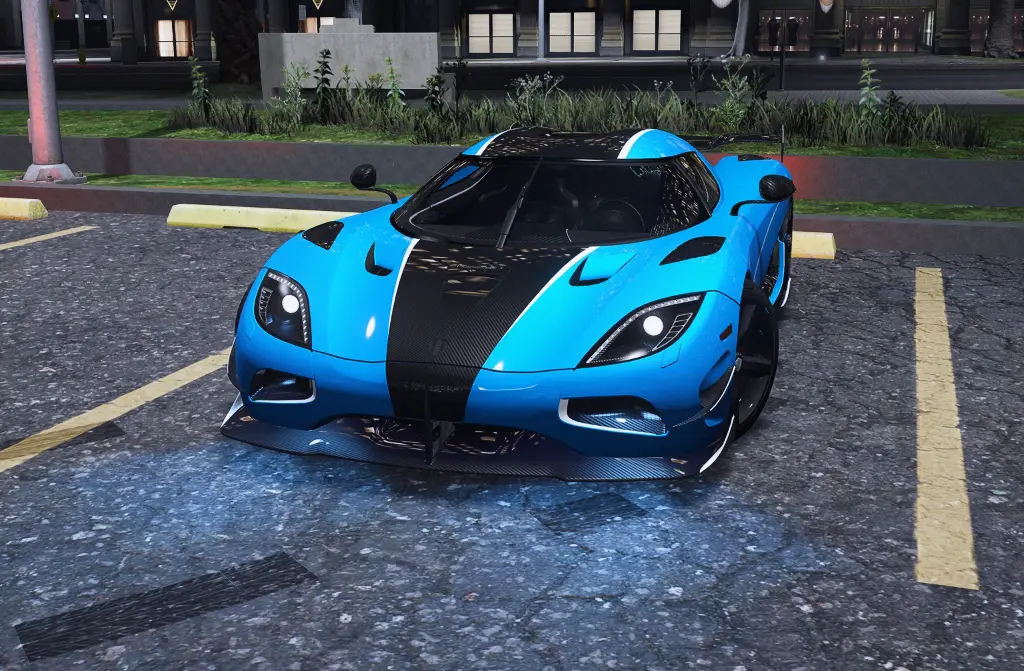 Blue and black track car in an open lot