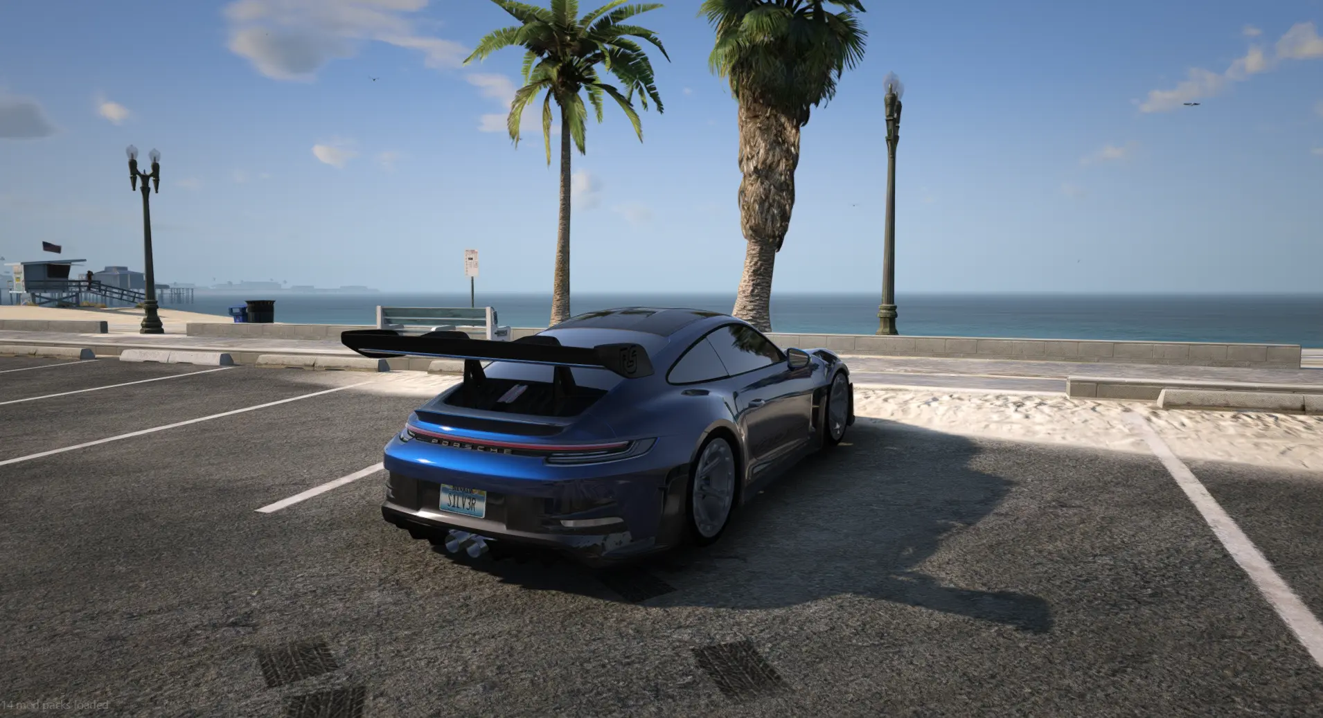 Blue sports car parked at the beachfront
